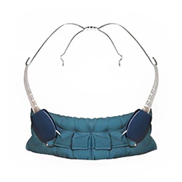 Orthodontic headgear with blue chin cup and metal straps for dental correction treatment.