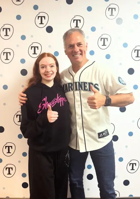 Man and young woman smiling at Tingey Orthodontics in Issaquah, Washington.